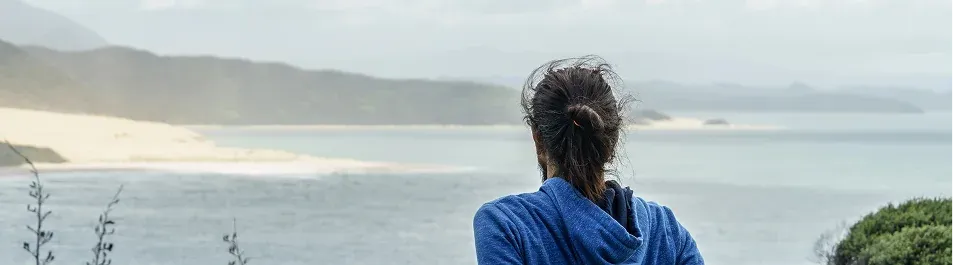 person alone looking over the ocean